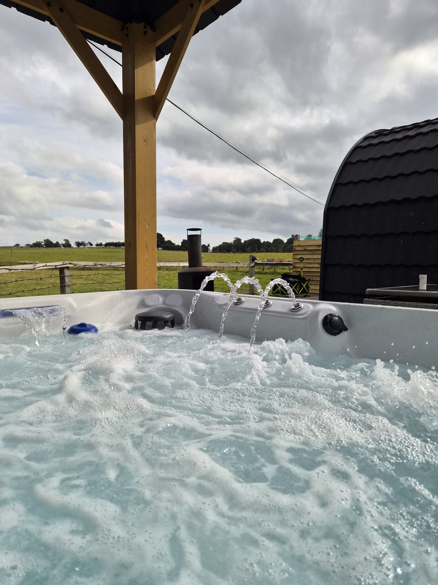 Water jets arcing across the Thistle Pod hot tub